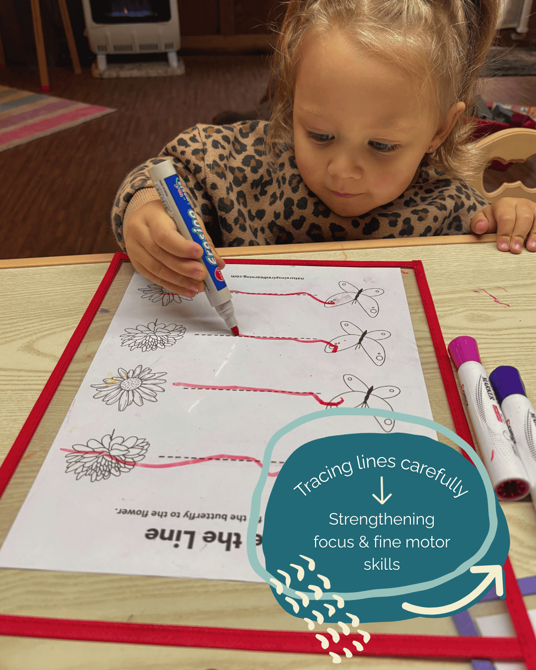 Child tracing lines with text that says: Tracing lines carefully: Strengthening focus & fine motor skills
