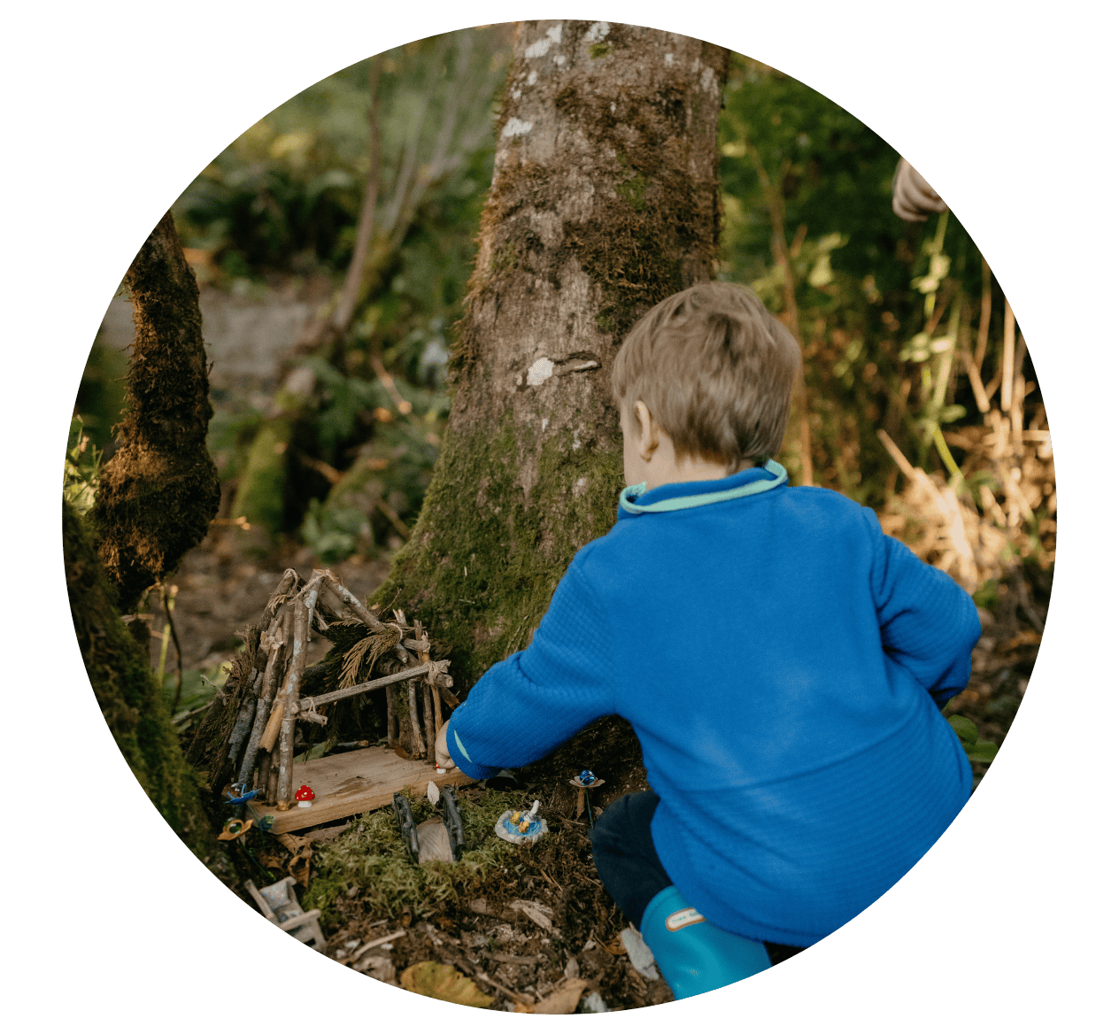Child playing with fair garden at Hidden Meadow School