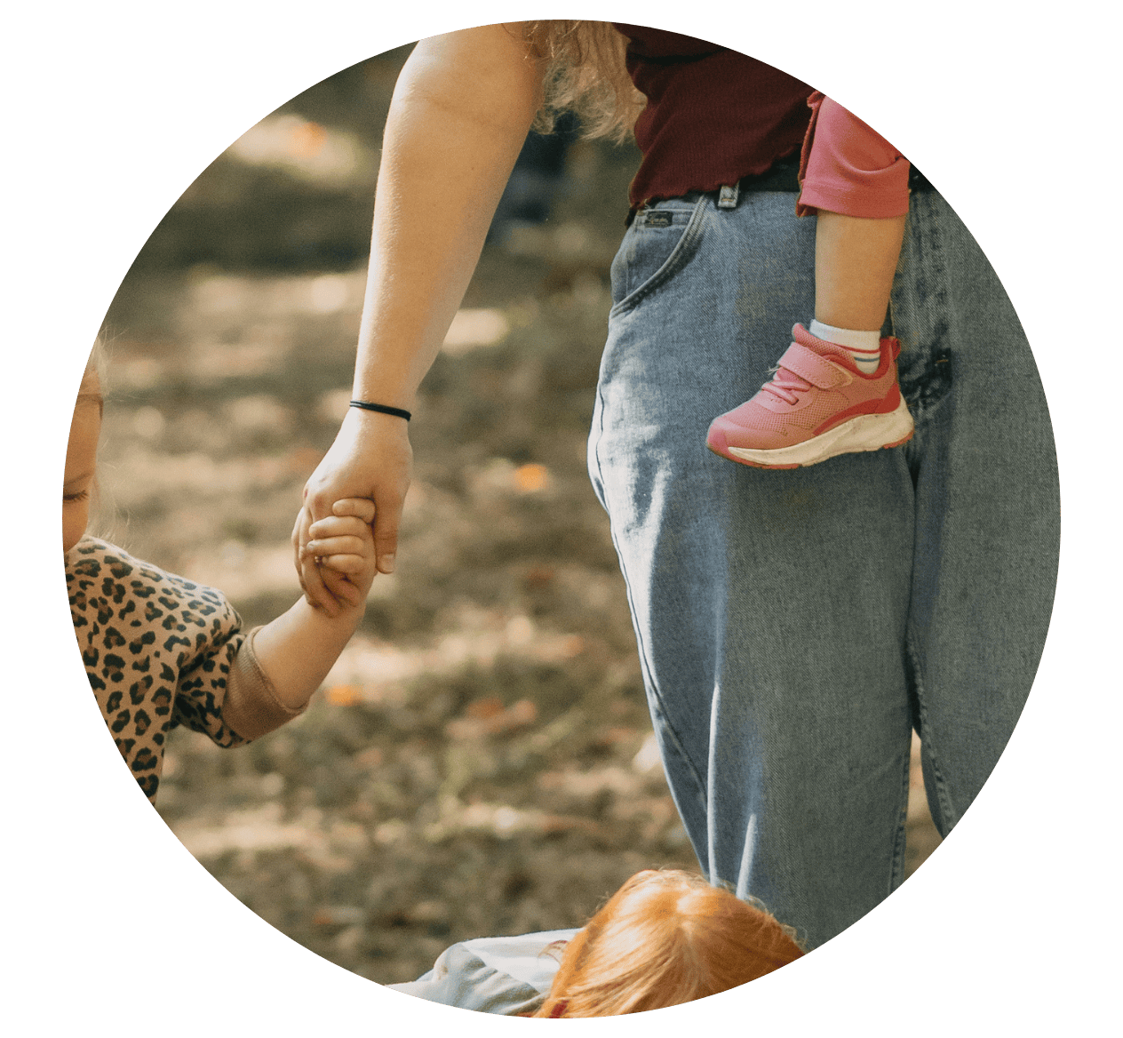 Woman holding child's hand 
